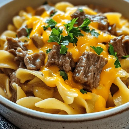Crockpot Beef & Noodles is more than just a meal; it’s a comforting experience that envelops you in its rich flavors and hearty textures. This Cheesy Bliss recipe is designed for those who crave a warm, satisfying dish that can be prepared with minimal effort, making it an ideal choice for busy weeknights or leisurely weekends. With tender beef, a creamy sauce, and perfectly cooked egg noodles, this dish has all the elements of a family favorite.
