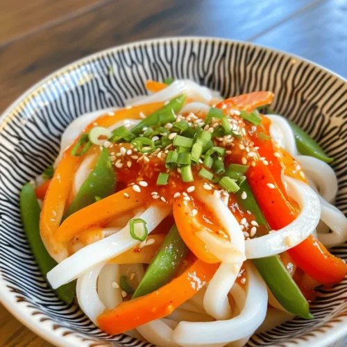 Udon noodles are a staple in Asian cuisine that have gained immense popularity across the globe. Known for their thick, chewy texture and ability to absorb flavors, these Japanese noodles are a beloved choice for both traditional dishes and modern adaptations. One such adaptation that is quickly becoming a favorite among busy individuals and families is the Spicy Chili Oil Udon Noodles. This dish embodies the perfect combination of simplicity and bold flavors, making it an ideal option for anyone looking to whip up a delicious meal in just 10 minutes.