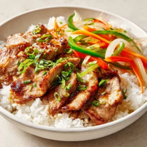 Savory Pork Shogayaki is a delectable Japanese dish that brilliantly marries the rich flavors of tender pork with aromatic ginger and a sweet-salty sauce. This meal is perfect for any occasion, whether it’s a weeknight dinner or a special gathering with family and friends. The combination of thinly sliced pork, crunchy vegetables, and the savory marinade creates an explosion of flavors that is both comforting and fulfilling.