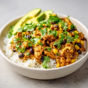 Tropical Chicken Curry Burrito Bowl is an exciting and flavorful dish that perfectly balances the spicy warmth of curry with the creamy goodness of coconut milk. This vibrant bowl features a combination of aromatic spices, tender chicken, and a variety of wholesome ingredients—all served over a base of fluffy basmati rice. It’s a sumptuous meal that not only pleases the palate but also nourishes the body with its array of proteins, vegetables, and grains.