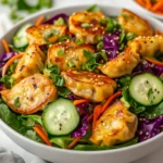 The Potsticker Salad Extravaganza is an innovative and delightful dish that combines the beloved flavors of potstickers with a refreshing salad twist. Featuring crispy potstickers on a bed of mixed greens and vibrant vegetables, it stands out as a wonderful fusion of ingredients. As the culinary landscape continues to evolve, potstickers, traditionally enjoyed as appetizers or snacks, have garnered popularity due to their versatility and flavor. This salad captures the essence of these savory dumplings while introducing crispiness, freshness, and brightness through the accompanying ingredients.