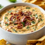When it comes to the ultimate comfort food that is perfect for a gathering, the Cheesy Bacon Burger Queso Dip shines as a standout option. This delectable dip combines some of the most beloved flavors, bringing together savory ground beef, rich cream cheese, and a blend of melty cheeses with the satisfying crunch of crispy bacon. Whether you’re hosting a game day party, a family gathering, or simply enjoying a cozy night at home, this dip is sure to make the occasion feel special.