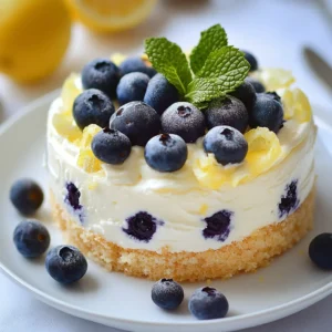 The No-Bake Luminous Lemon Blueberry Cream Cake is a delightful and refreshing dessert that encapsulates the essence of summer in each bite. Bursting with vibrant flavors, this cake combines the zesty brightness of lemon with the sweetness of blueberries, creating a harmonious blend that is as pleasing to the palate as it is to the eye. Its creamy filling and crunchy graham cracker crust offer an irresistible contrast that is both luxurious and light, making it the ideal treat for hot days.