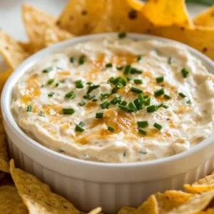 Sweet Vidalia Onion Dip Delight is a creamy and savory dip that captures the essence of caramelized Vidalia onions. These onions, known for their sweet and mild flavor, lend themselves beautifully to the dip, creating a perfect blend with the other rich ingredients. Ideal for gatherings or cozy nights in, this dish is exceptionally versatile, serving as a tantalizing appetizer, a game-day snack, or a comforting side during family dinners.