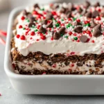 The No-Bake Holiday Cookie Lasagna is a delightful dessert that brings together festive flavors and a stunning presentation without the need for an oven. Ideal for the holiday season, it's a perfect make-ahead dish that allows you to reduce time spent in the kitchen, leaving you free to enjoy the celebrations with family and friends. The beauty of this treat lies in its layered structure, combining creamy, sweet layers with a satisfying crunch, which resonates with both kids and adults alike.