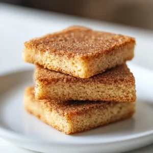 Crafting desserts that capture the essence of home and nostalgia can be immensely rewarding, and nothing embodies this sentiment quite like snickerdoodle bars. These soft, chewy delights are a beloved treat, marrying the warm spices of cinnamon with a sweet, buttery base. Unlike traditional cookies, these bars deliver the same comforting flavors in an easy-to-make format that’s perfect for sharing and enjoying with loved ones. Every bite of a snickerdoodle bar promises an experience of sweetness, spice, and warmth that transports you back to cozy gatherings and cherished memories.