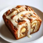 Exploring cherished morning favorites often leads to introductions to delightful twists in traditional recipes. One such gem is Cinnamon Swirl Banana Bread, a warm, cozy delight that celebrates the rich flavors of ripe bananas, sweet cinnamon, and a hint of creamy topping. This recipe not only satisfies cravings but also creates a comforting atmosphere perfect for breakfast or snacking.