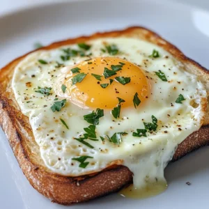 Exploring the comforts of French cuisine, Croque Madame emerges as a beloved classic that elegantly combines flavors and textures. This rich, cheesy sandwich topped with a perfectly fried egg provides an indulgent start to your morning or a delightful brunch option that is sure to impress. The layers of toasted sourdough, creamy cheese sauce, and a sunny-side-up egg create a satisfying dish that not only delivers on taste but also presents beautifully at the table.