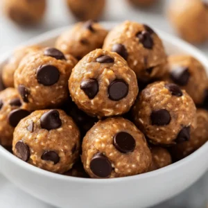 In the realm of quick, nutritious snacks, no-bake recipes stand out for their simplicity and deliciousness. Among these, Decadent No-Bake Peanut Butter Energy Bites not only provide a satisfying treat but also deliver a healthy punch of protein and energy. These energy bites combine the smooth richness of peanut butter, the wholesome quality of oats, and the chocolatey sweetness that makes for a balanced snack choice. Ideal for a quick pick-me-up for both adults and children, these bites fit perfectly into a busy lifestyle.