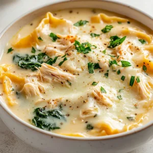 This Decadent White Chicken Lasagna Soup brings a delightful twist to traditional Italian flavors. Imagine the comfort of a creamy lasagna presented in the heartwarming, wholesome form of a soup. With tender pieces of chicken, fresh greens, and rich dairy, this dish combines the essence of lasagna with the soothing familiarity of soup. It’s perfect for those chilly evenings when you crave something that warms both your body and your spirit or for special occasions where you want to impress your guests with a unique, comforting dish.