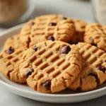 The world of baking is filled with mouth-watering recipes that bring joy to both the baker and the enjoyer alike. One such delightful creation is the Peanut Butter Delight Cookies, a treat that merges the rich, nutty flavor of peanut butter with the sweetness of chocolate. These cookies are perfect for occasions ranging from casual family gatherings to special celebrations, offering a comforting, homemade dessert option everyone can love. Their warm, peanut buttery essence paired with the option of chocolate chips makes them not just a dessert but an experience that evokes childhood memories and heartwarming moments.
