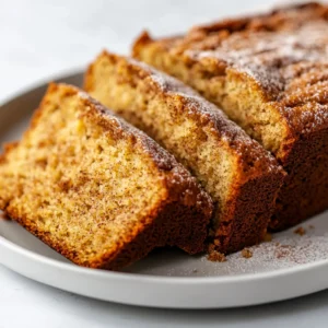 There’s something incredibly comforting about banana bread, particularly when it emerges from the oven, golden brown and aromatic. The classic combination of soft, ripe bananas and warm spices evokes feelings of home and warmth. Now, imagine elevating that beloved treat by giving it a delightful twist: Snickerdoodle Banana Bread Delight. This recipe beautifully marries the classic banana bread with the warm, cozy flavors of snickerdoodle cookies, resulting in a dessert that not only satisfies your sweet tooth but also intrigues your taste buds.