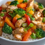 The Savory Chicken and Veggie Rice Bowl is a delightful blend of flavors and textures that embodies the essence of Asian fusion cuisine. This dish brings together succulent chicken, vibrant vegetables, and fluffy jasmine rice, making it not only an appealing meal but also a nutritious option for family dinners or meal prep. The combination of tender chicken breast and colorful, crisp vegetables creates a visually stunning and satisfying dish that will please both the eyes and the palate.