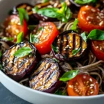 The Soba Salad with Grilled Eggplant and Tomato Delight presents an exquisite taste of Japanese cuisine, showcasing a delightful fusion of flavors and textures. This refreshing salad combines the nutty taste of soba noodles with the rich smokiness of grilled eggplant and the bright acidity of ripe tomatoes, creating a dish that can serve as a satisfying main course or a light side dish. Perfect for summer gatherings or intimate dinners, it offers a delightful balance of savory and fresh elements that is sure to please any palate.